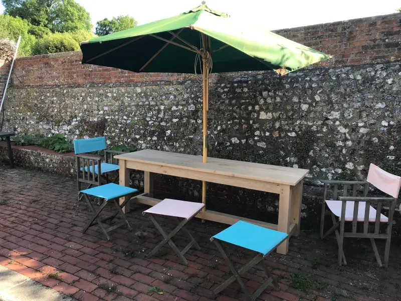 Oak garden table with parasol outdoors