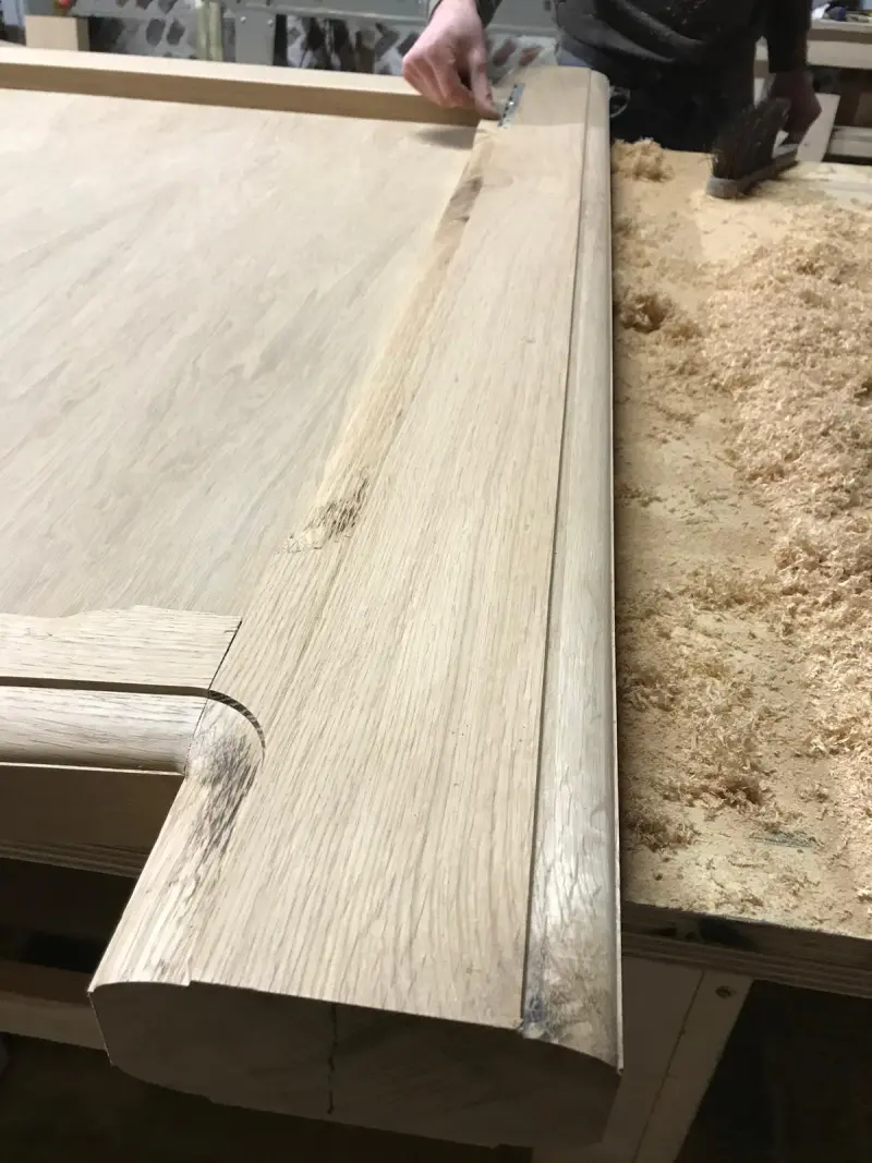 Oak door panel moulding detail in workshop
