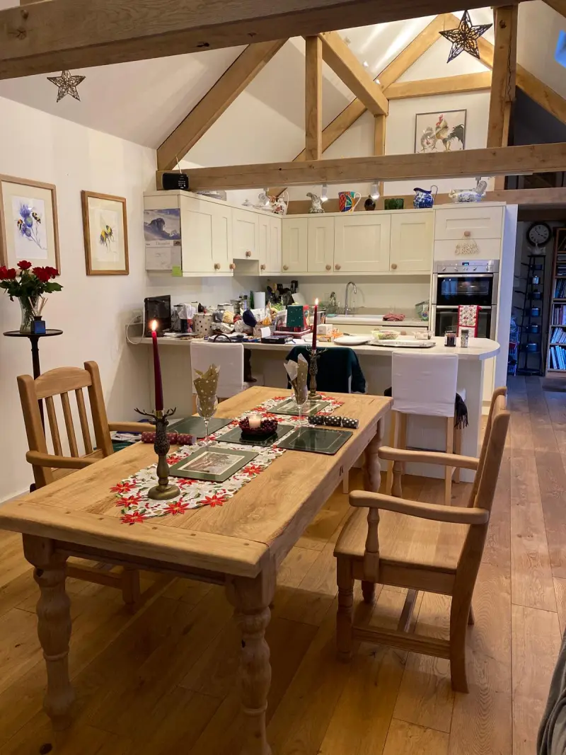 Dining table and chairs set in oak-beamed kitchen