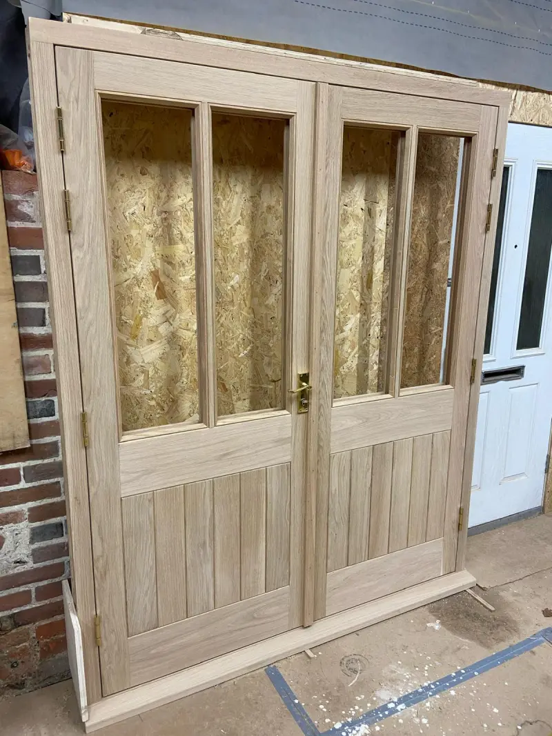 Oak french doors pre-finishing in workshop