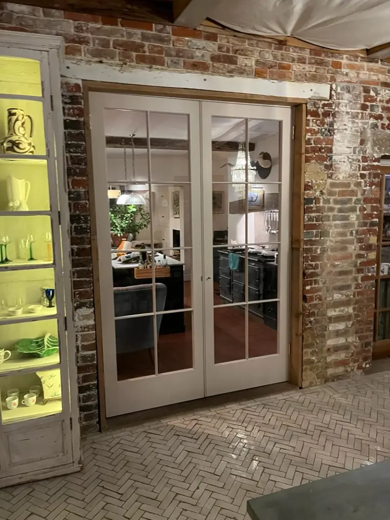 Internal french doors set in exposed brick wall
