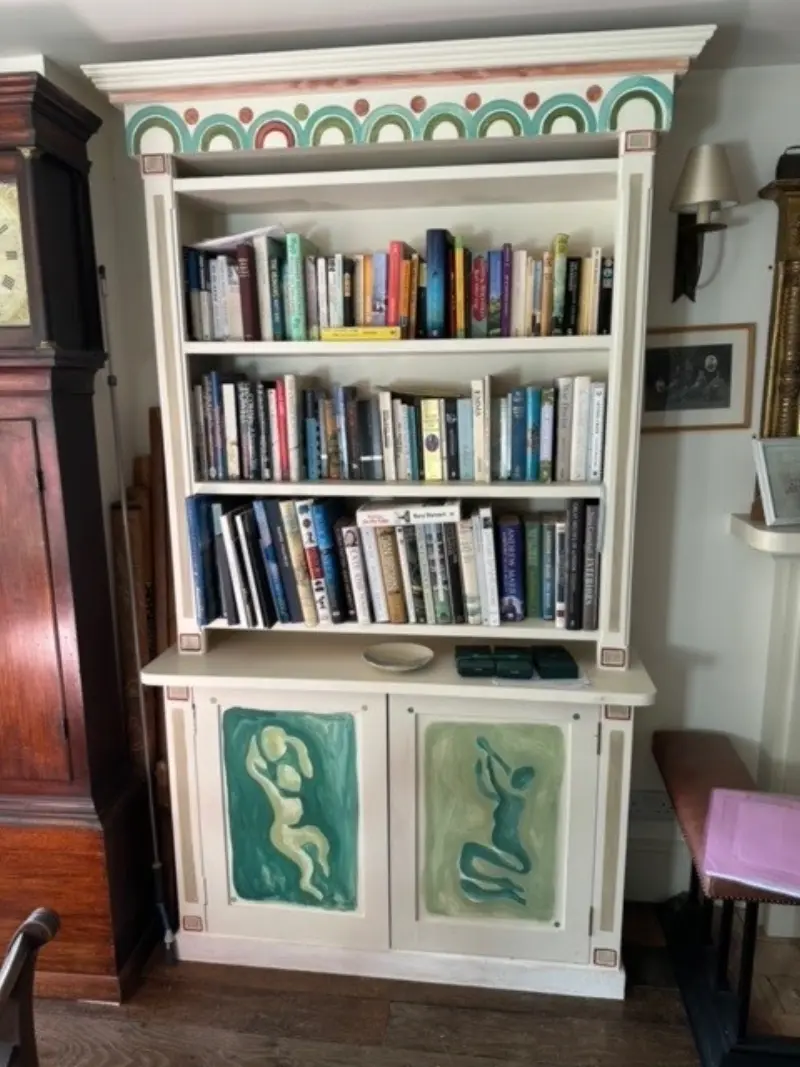 Bespoke painted bookcase with decorative panels